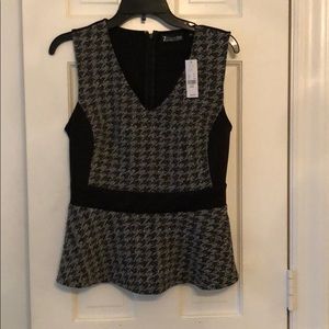 Peplum top. Cute paired with matching skirt suit.